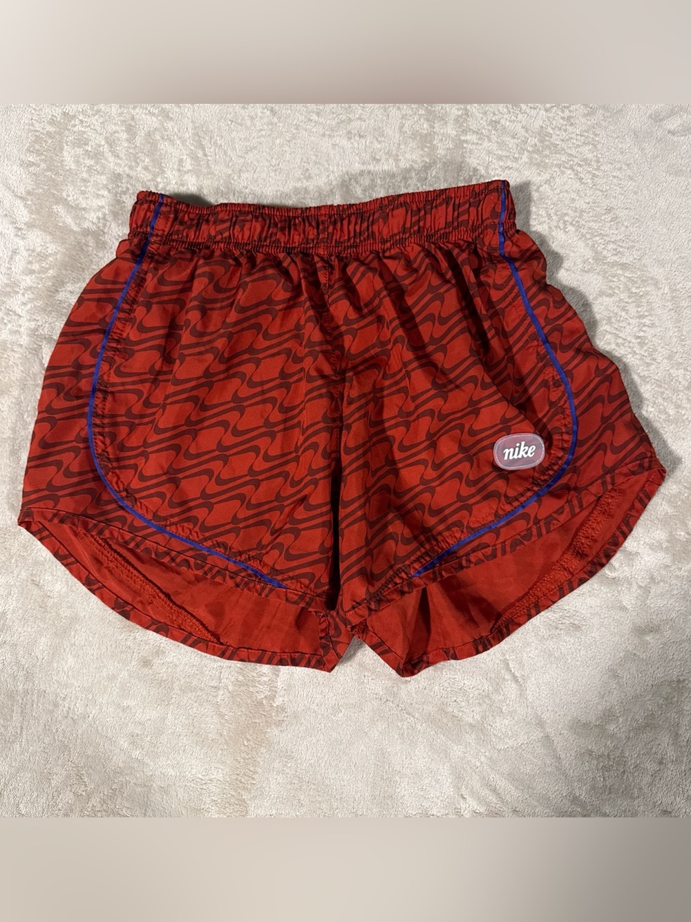 Nike Women's Red Patterned Athletic Shorts with Blue Trim